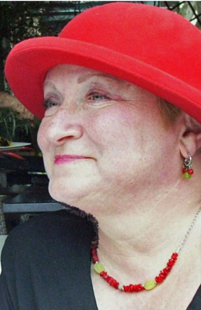 Susan M. Daniels wearing a red hat