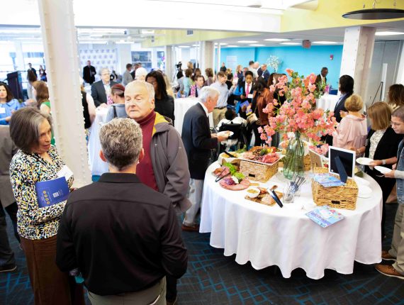 Attendees of Party4PYD 2023 mingle with each other.