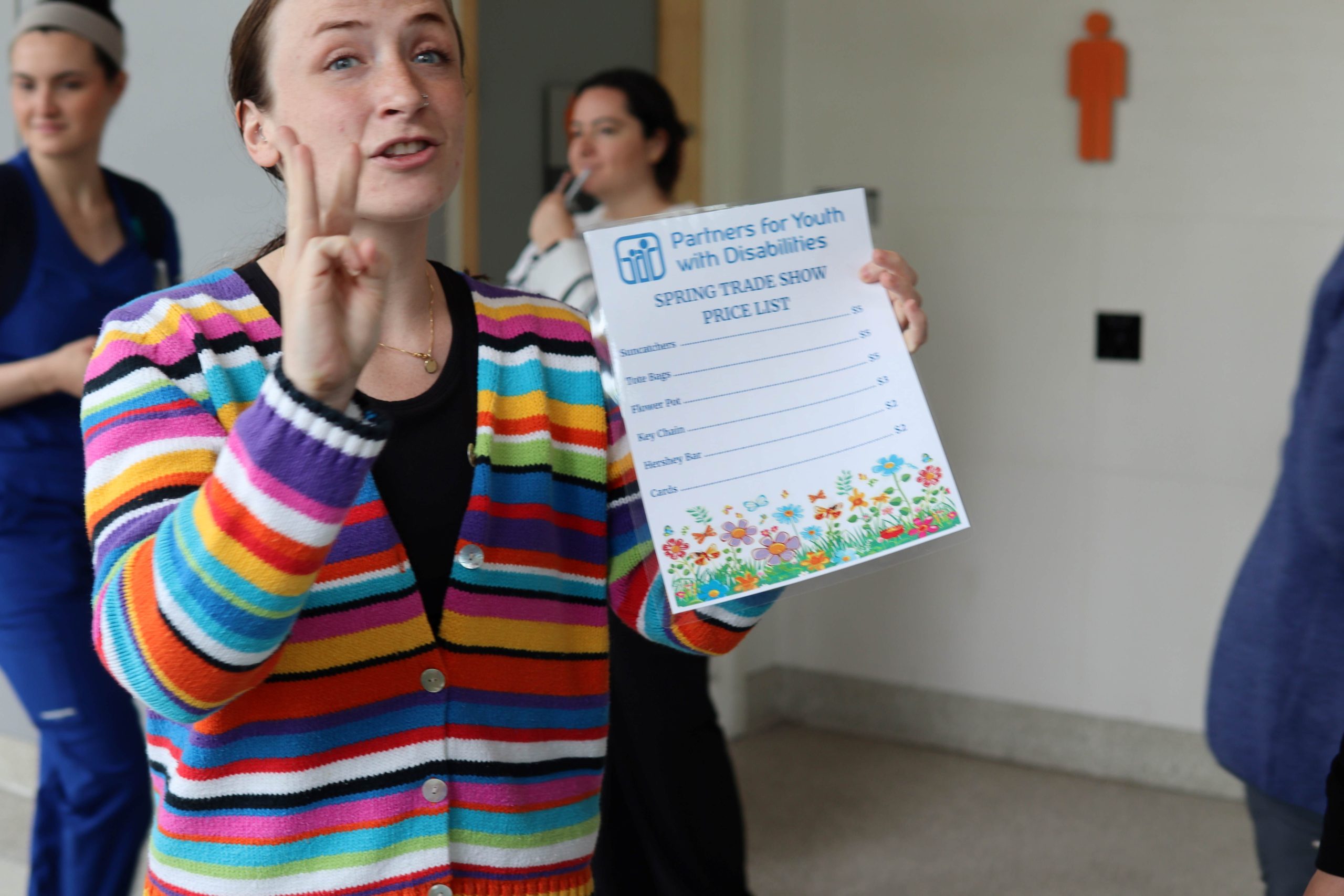 PYD staff member, Kristin Sullivan, explains the price sheet to students