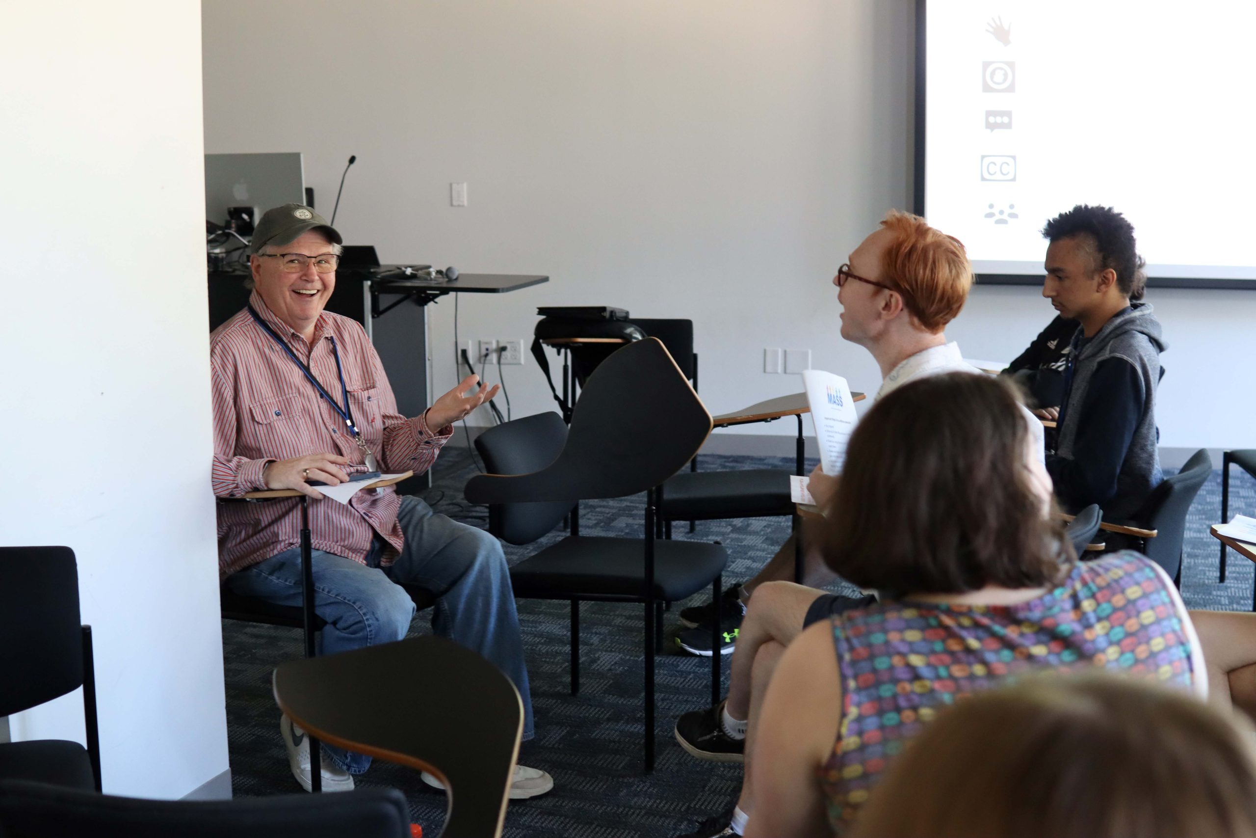A workshop leader gives a talk to YLF participants