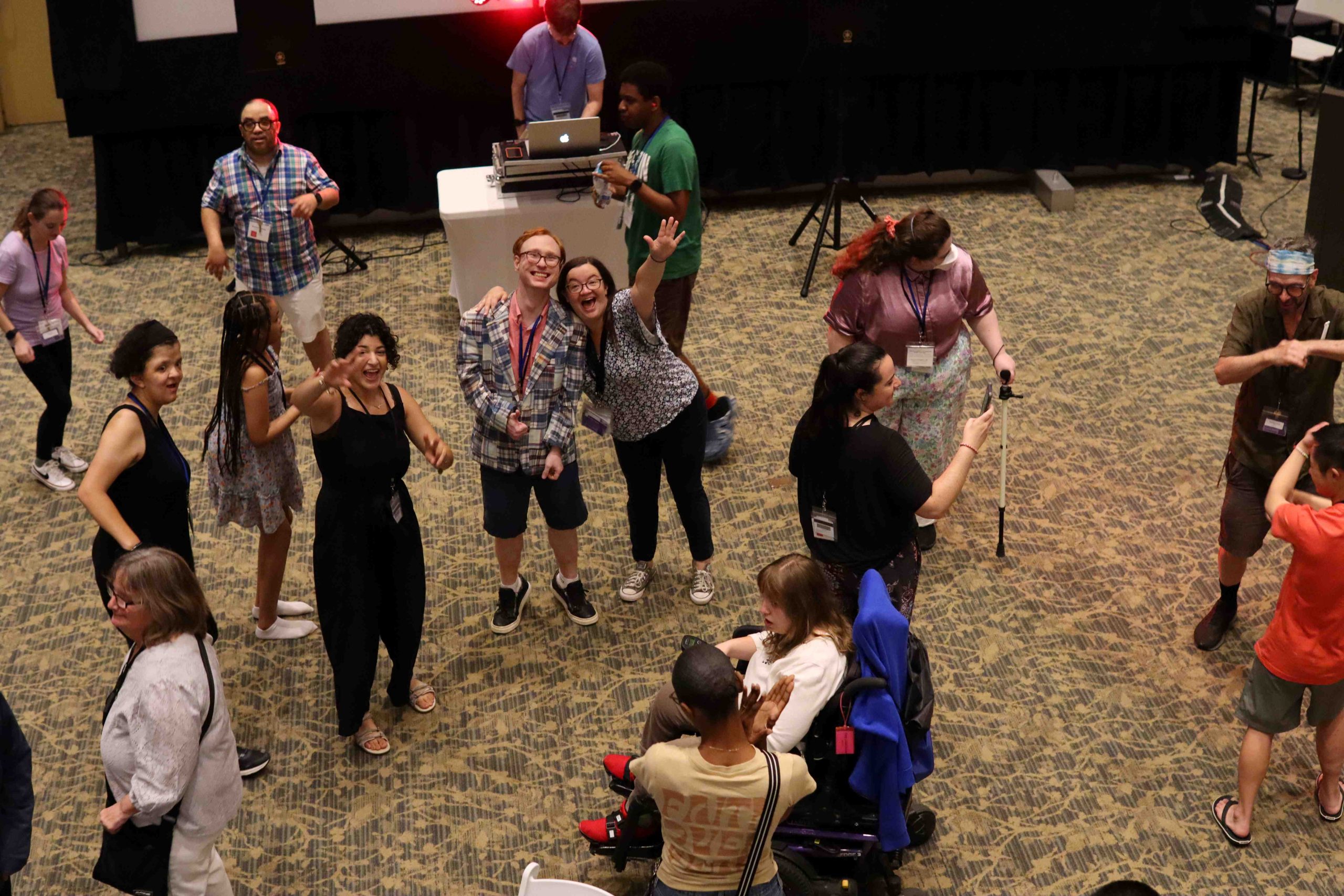 YLF participants smile and wave at the camera at the dance party.