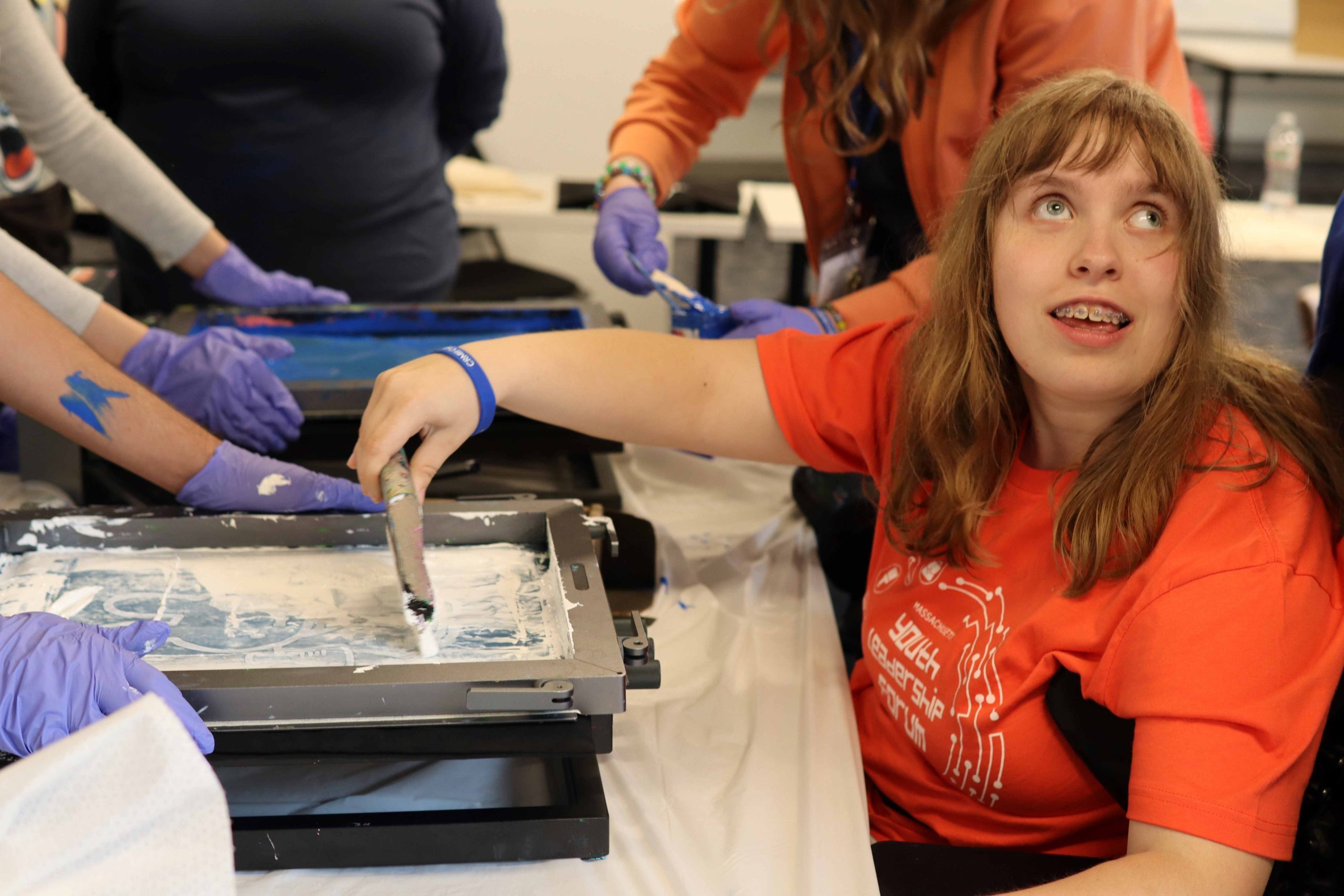 A YLF participant takes part in the silk screen tote bag workshop