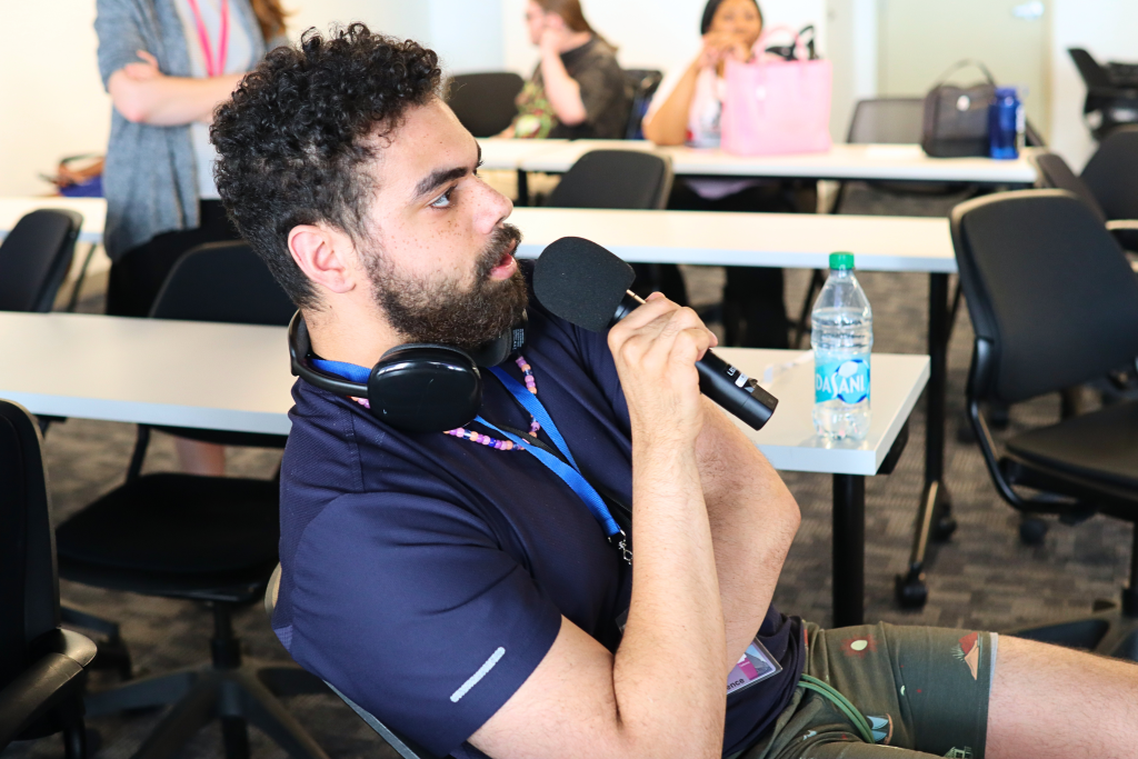 A YLF delegate speaks into a microphone.